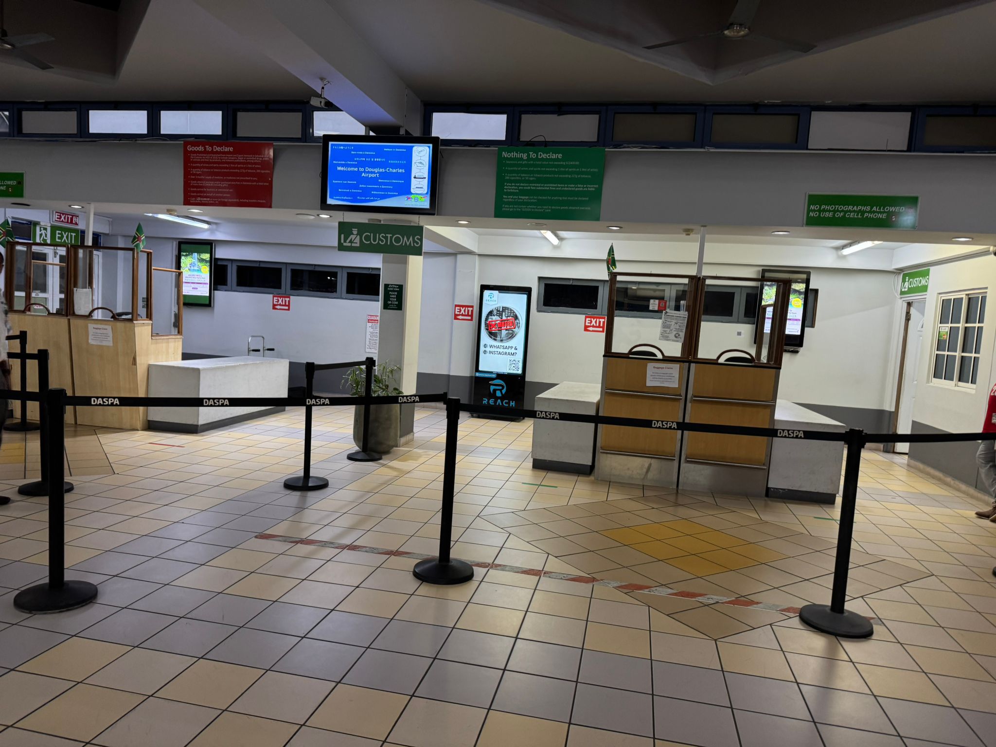 Reach Media airport screen in a customs arrival area