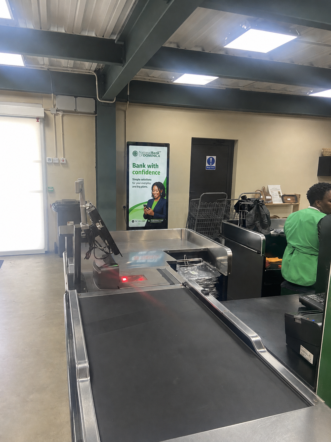NBD campaign mockup on Reach Media screen in supermarket checkout environment
